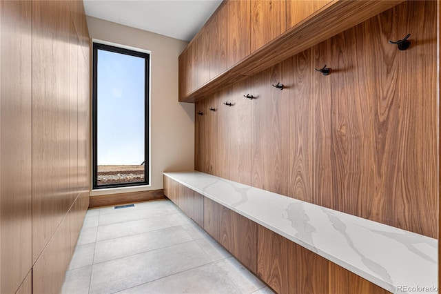 mudroom with light tile patterned flooring