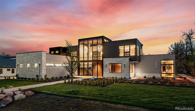 contemporary home featuring a yard