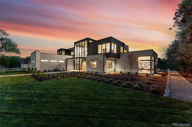 contemporary home featuring a lawn