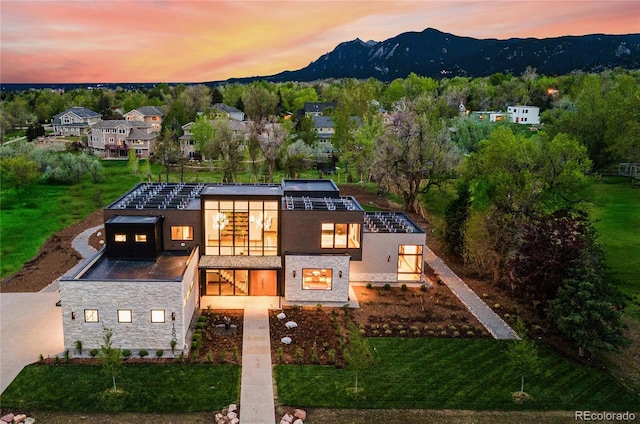 view of front of home featuring a mountain view