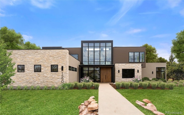 contemporary home with a front yard