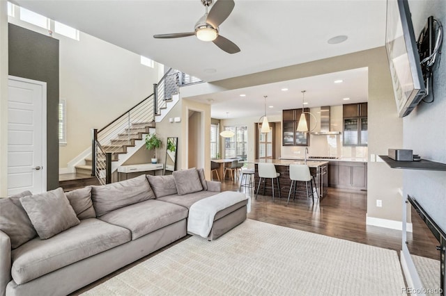9244 E 37th Ave, Denver, CO 80238 - living area featuring dark wood-type flooring, stairs, a ceiling fan, and recessed lighting