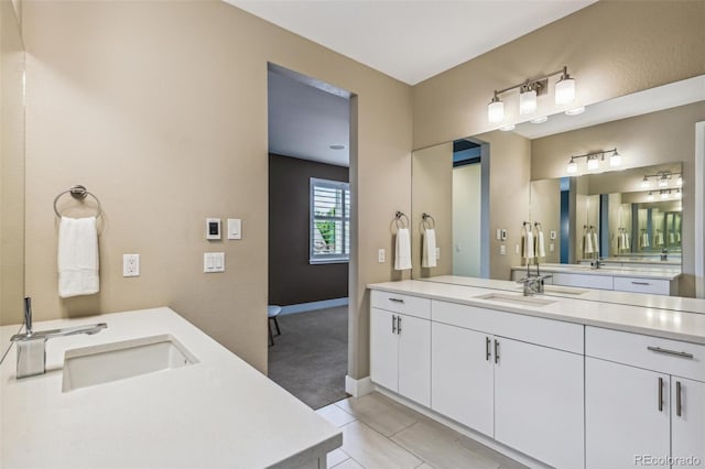9244 E 37th Ave, Denver, CO 80238 - full bath with two vanities and tile patterned floors