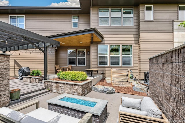 9244 E 37th Ave, Denver, CO 80238 - view of patio featuring an outdoor living space with a fire pit and grilling area