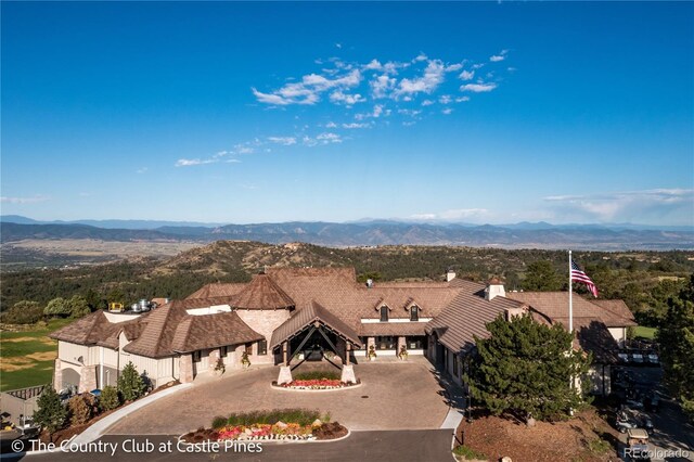 birds eye view of property with a mountain view