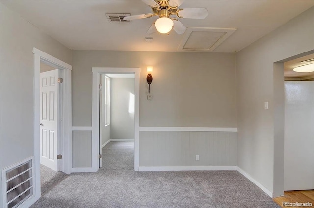 unfurnished room with light carpet and ceiling fan