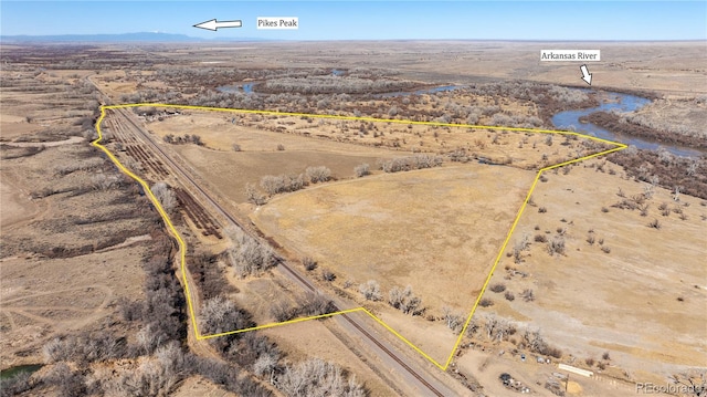 birds eye view of property featuring view of desert and a rural view