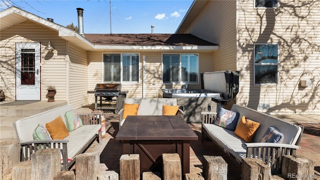 wooden terrace with exterior kitchen, outdoor lounge area, a grill, and a patio