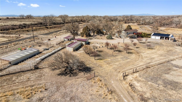 drone / aerial view featuring a rural view and a desert view