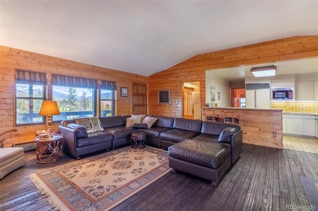 1295 Gcr 49, Grand Lake, CO 80447 - living area featuring wooden walls, lofted ceiling, and hardwood / wood-style floors