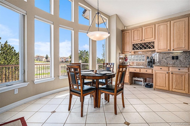 11065 W Rockland Dr, Littleton, CO 80127 - dining space with light tile patterned floors and baseboards