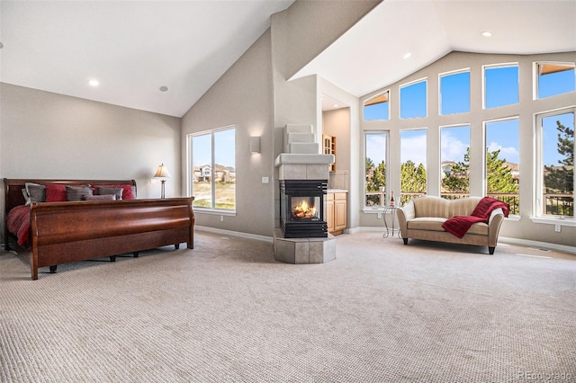 11065 W Rockland Dr, Littleton, CO 80127 - carpeted bedroom featuring baseboards, high vaulted ceiling, a tiled fireplace, and recessed lighting