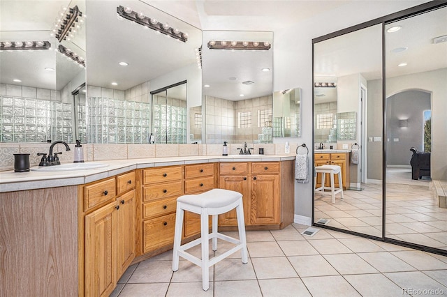 11065 W Rockland Dr, Littleton, CO 80127 - full bathroom with double vanity and tile patterned flooring
