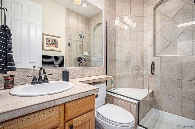 11065 W Rockland Dr, Littleton, CO 80127 - bathroom with vanity, a shower stall, and toilet