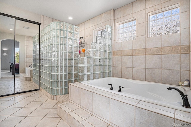 11065 W Rockland Dr, Littleton, CO 80127 - bathroom featuring a bath, tile walls, tile patterned flooring, a walk in shower, and recessed lighting
