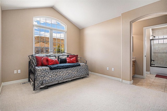 11065 W Rockland Dr, Littleton, CO 80127 - bedroom with vaulted ceiling, carpet flooring, baseboards, and ensuite bathroom