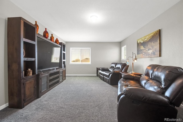 carpeted living area with baseboards