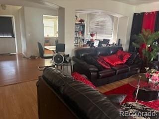 19939 Mitchell Cir, Denver, CO 80249 - living room with wood finished floors and arched walkways