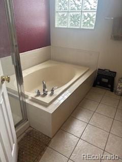 19939 Mitchell Cir, Denver, CO 80249 - bathroom with a bath, tile patterned floors, and a stall shower