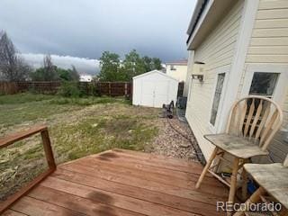 19939 Mitchell Cir, Denver, CO 80249 - deck with a storage shed and a fenced backyard