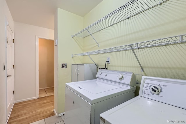 19939 Mitchell Cir, Denver, CO 80249 - laundry area featuring washing machine and dryer and light wood finished floors