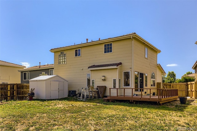 19939 Mitchell Cir, Denver, CO 80249 - back of house featuring a deck, a storage shed, and a fenced backyard