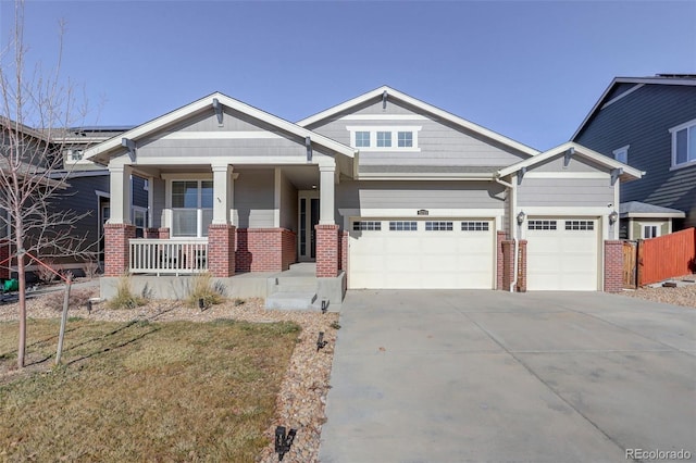 craftsman-style house featuring a porch and a garage