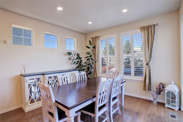 dining area featuring wood-type flooring