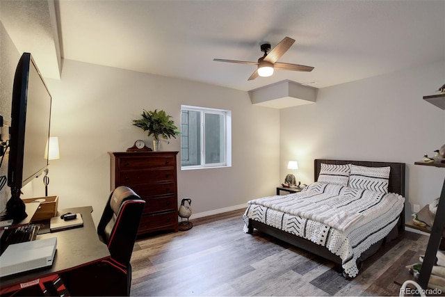 bedroom featuring ceiling fan and wood-type flooring