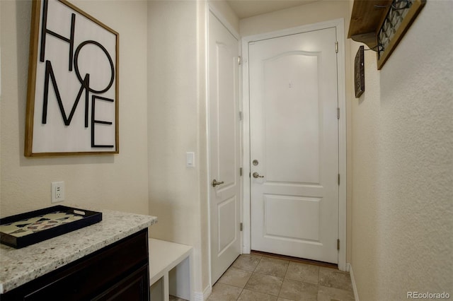 entryway featuring light tile patterned floors