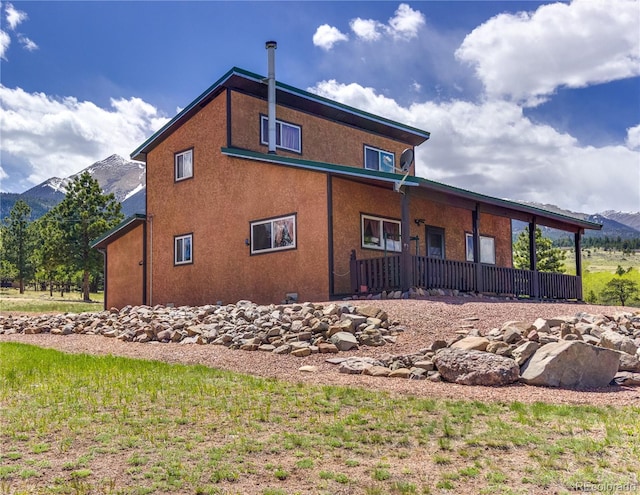 62 Rubel Cir, Westcliffe, CO 81252 - view of side of home featuring a mountain view and stucco siding