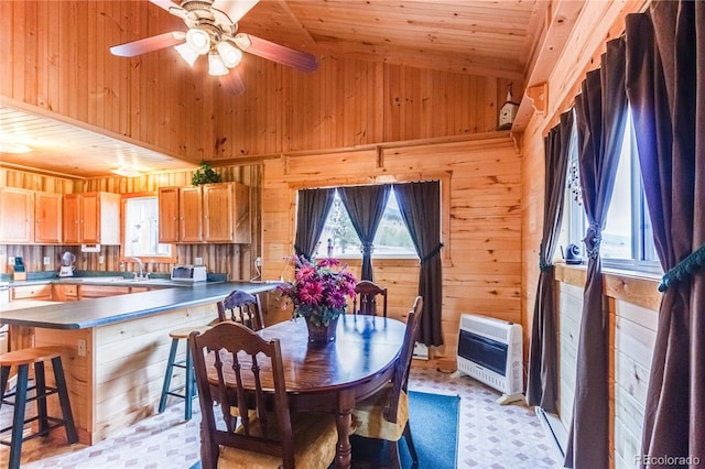 62 Rubel Cir, Westcliffe, CO 81252 - dining space with heating unit, wood walls, ceiling fan, wood ceiling, and high vaulted ceiling