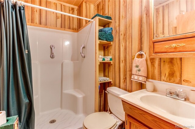 62 Rubel Cir, Westcliffe, CO 81252 - bathroom with curtained shower, vanity, toilet, and wood walls