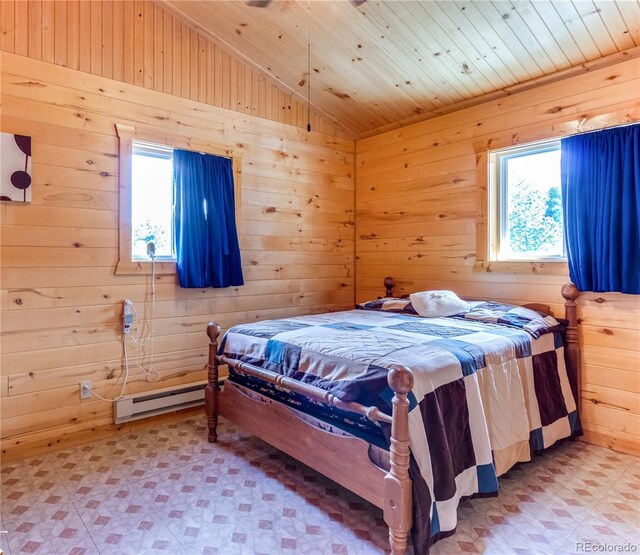 62 Rubel Cir, Westcliffe, CO 81252 - bedroom with lofted ceiling, a baseboard heating unit, light flooring, wood walls, and wooden ceiling