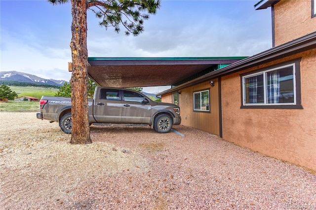 62 Rubel Cir, Westcliffe, CO 81252 - view of vehicle parking with a mountain view and an attached carport