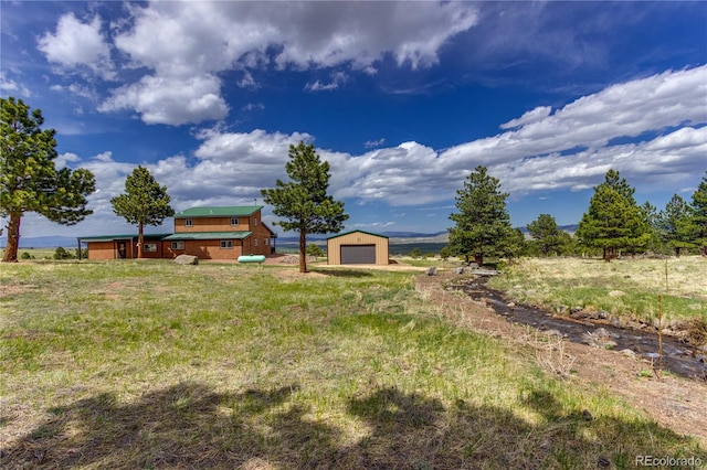 62 Rubel Cir, Westcliffe, CO 81252 - view of yard with a garage and an outbuilding
