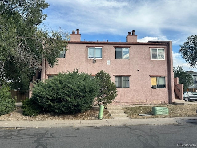 view of property with central air condition unit