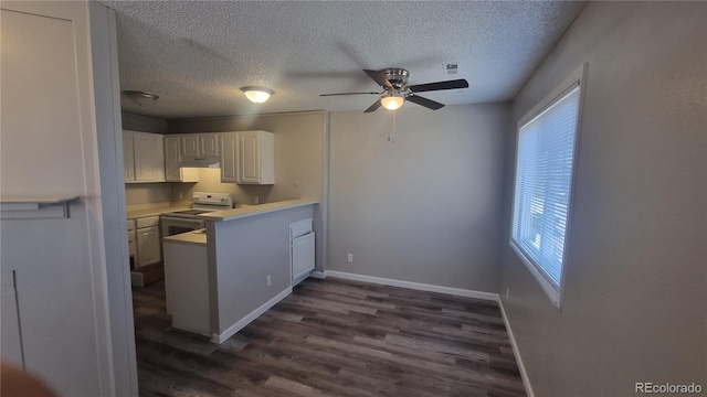 kitchen featuring a textured ceiling, white range with electric cooktop, white cabinetry, ceiling fan, and dark hardwood / wood-style floors