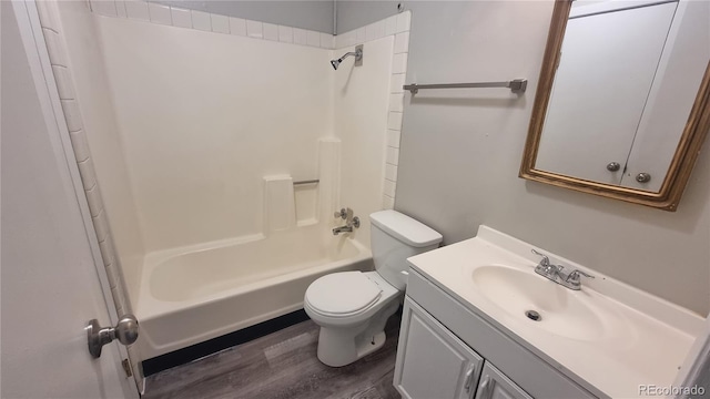 full bathroom featuring vanity, wood-type flooring, toilet, and shower / bath combination