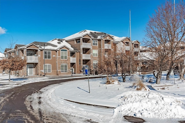 view of snow covered property