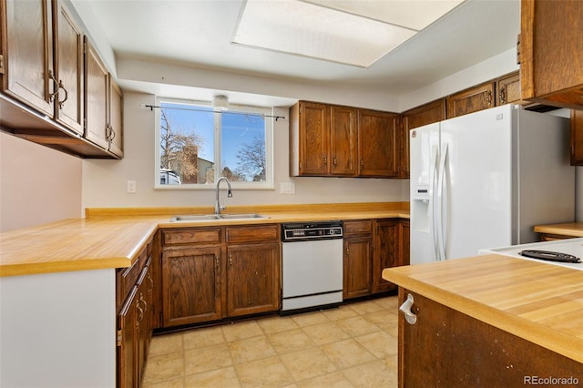 kitchen with sink and white appliances