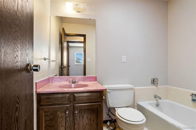 bathroom featuring vanity, toilet, and a bathtub