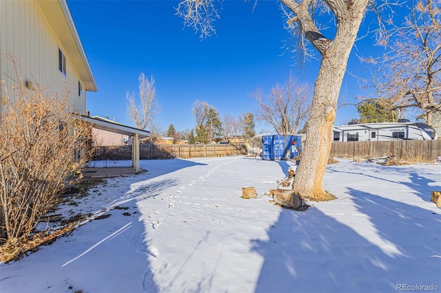 view of yard covered in snow