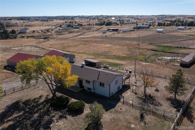 birds eye view of property with a rural view