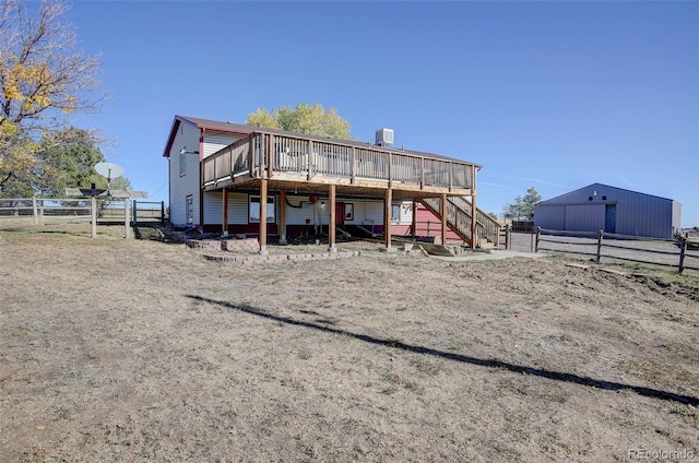 back of house featuring a deck