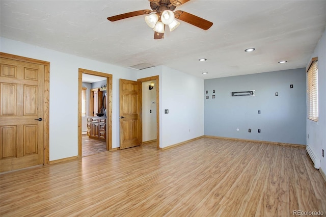 empty room with light hardwood / wood-style flooring and ceiling fan