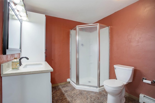 bathroom with vanity, a baseboard heating unit, a shower with shower door, and toilet