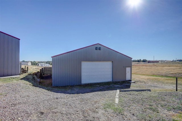 garage featuring a rural view