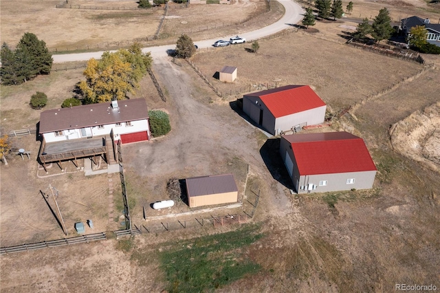 birds eye view of property featuring a rural view