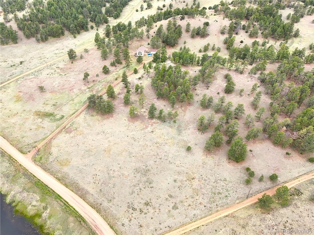 birds eye view of property featuring a rural view